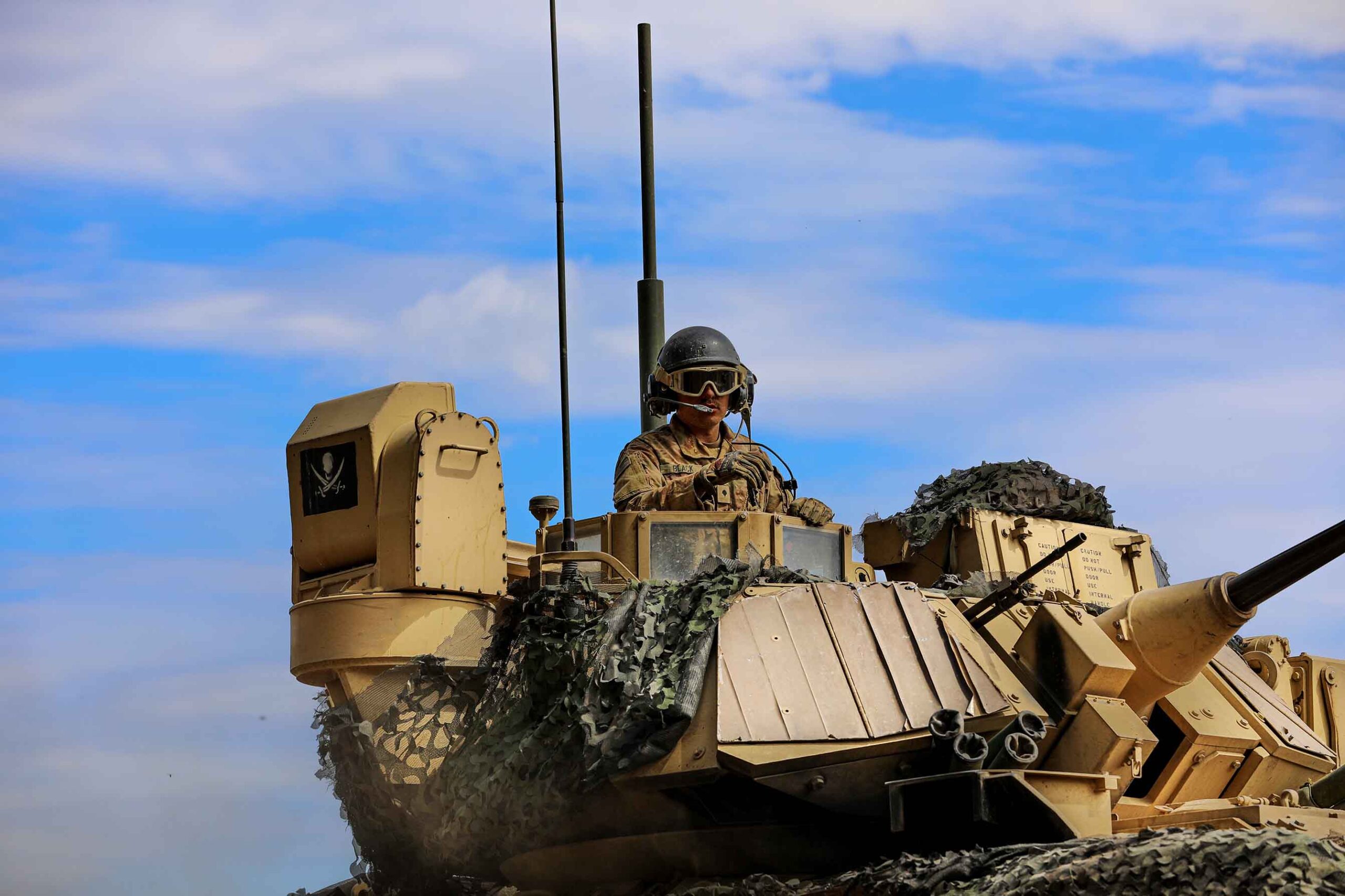 soldier in bradley fighting vehicle
